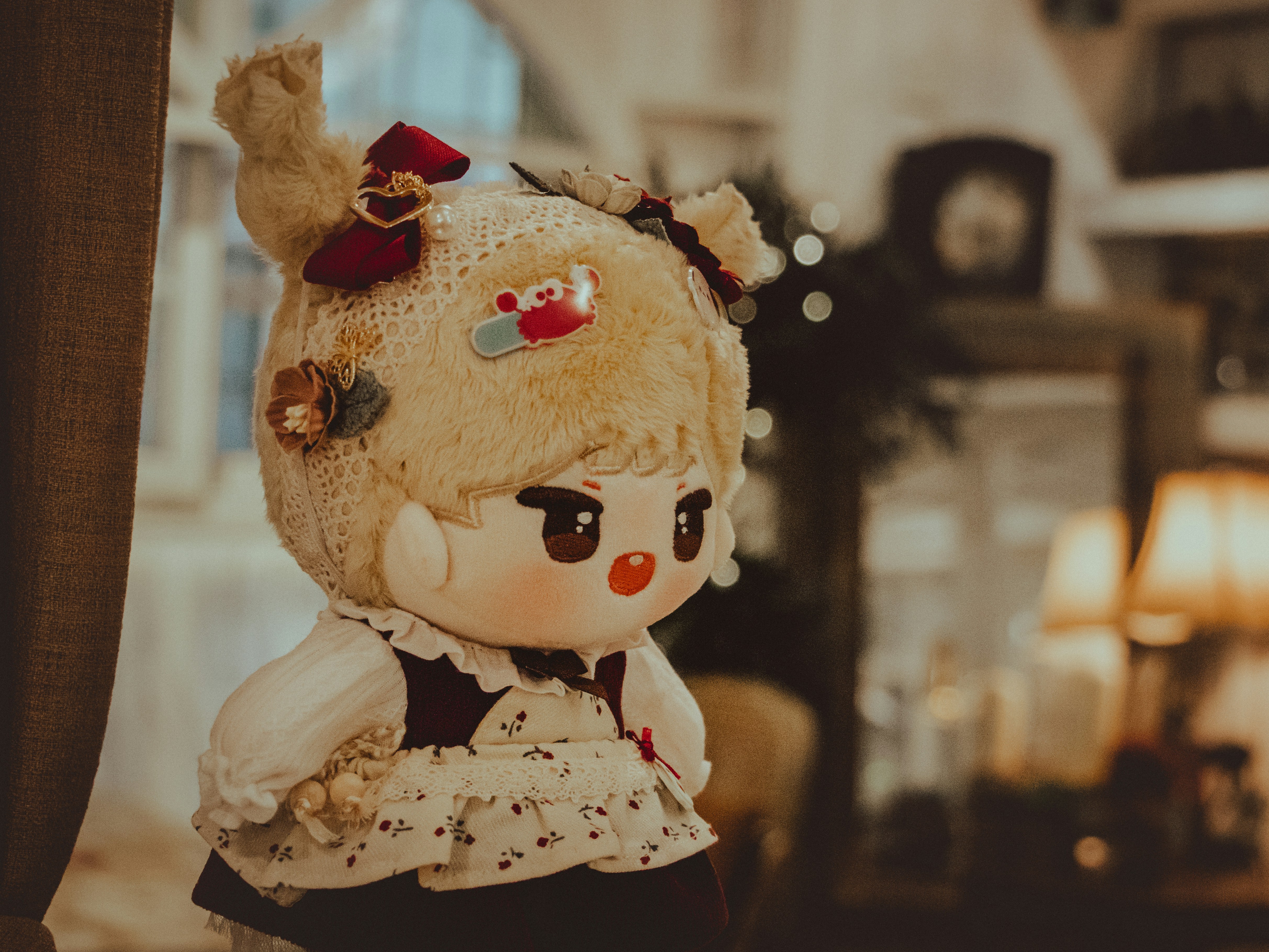 a stuffed animal doll with a dress and a bow