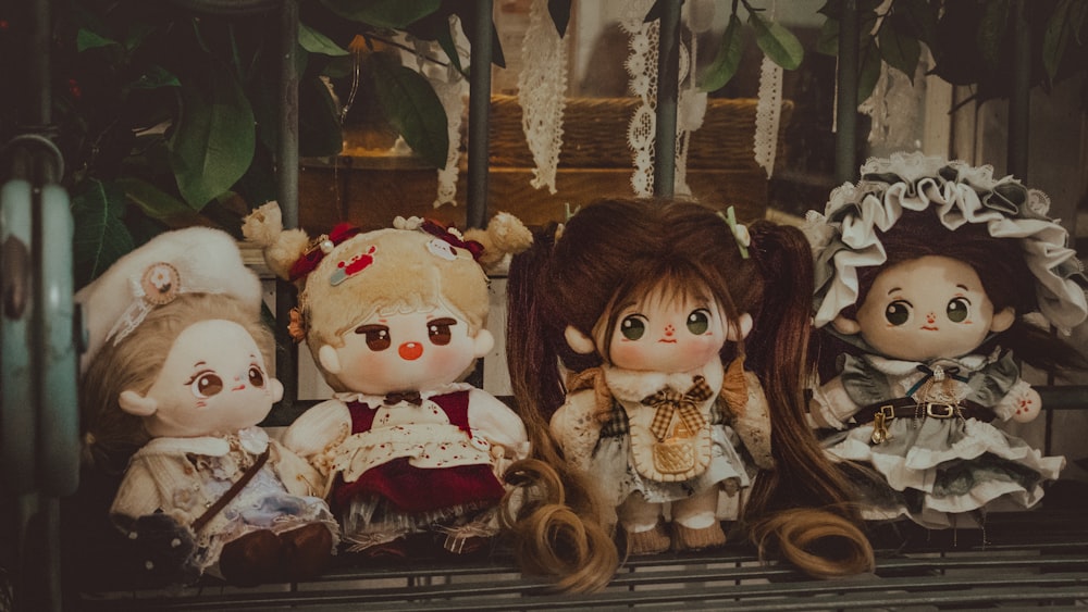 a group of dolls sitting next to each other