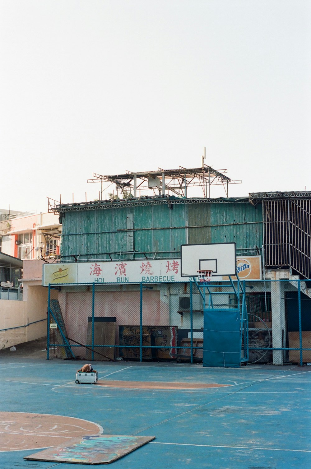 a basketball court in front of a building
