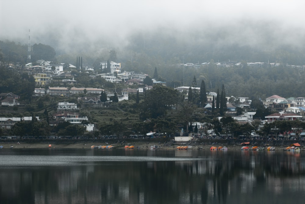 a city on a hill with a body of water in front of it