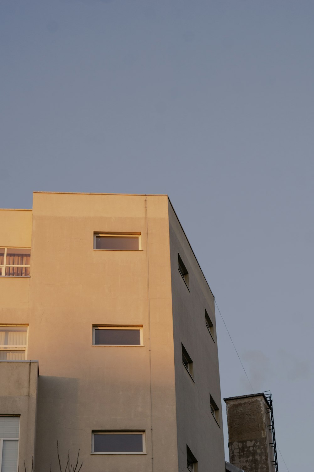 a tall building with a clock on the side of it