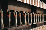 a row of bottles on a shelf in a store