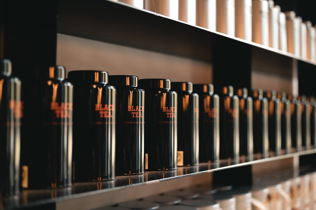 a row of bottles on a shelf in a store,