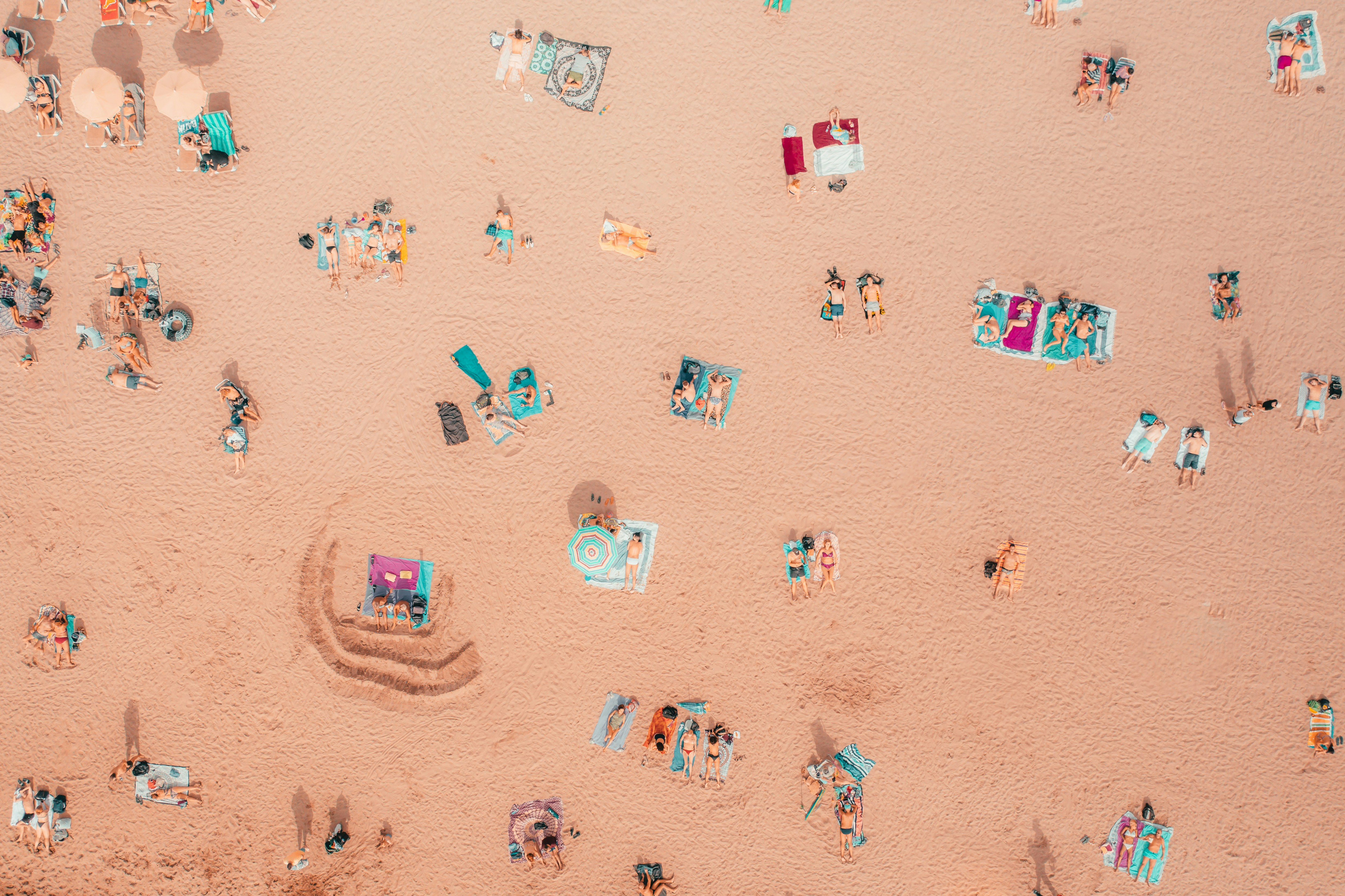 an aerial view of a beach with a lot of people