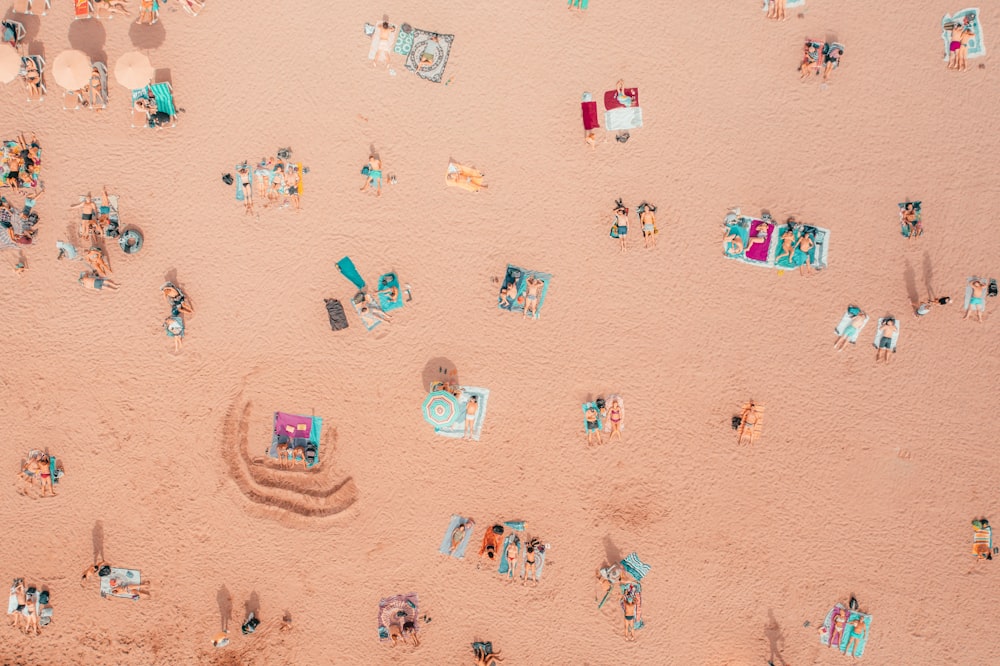 an aerial view of a beach with a lot of people