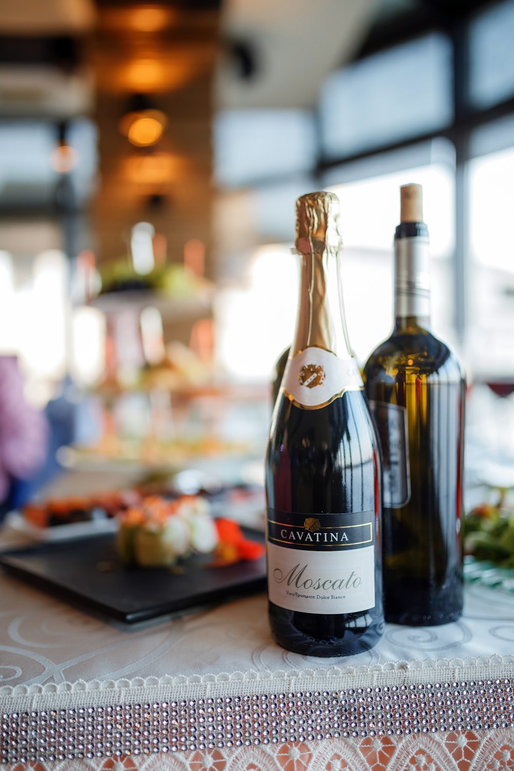 two bottles of wine are sitting on a table