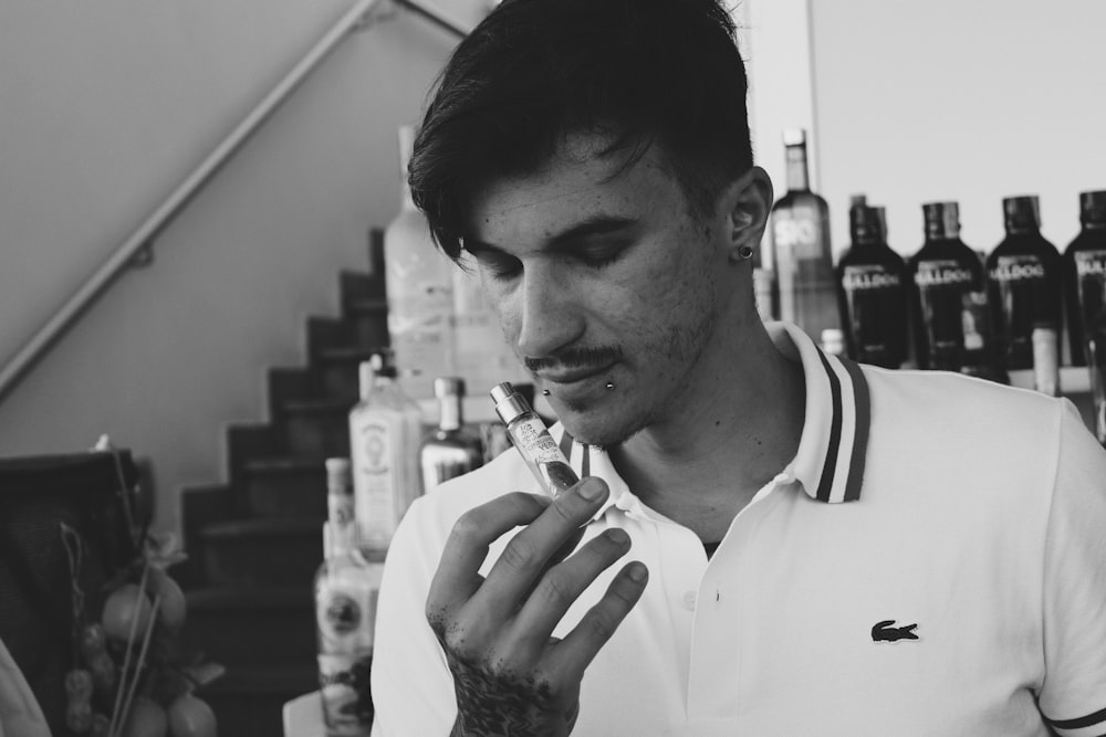 a man smoking a cigarette in a bar