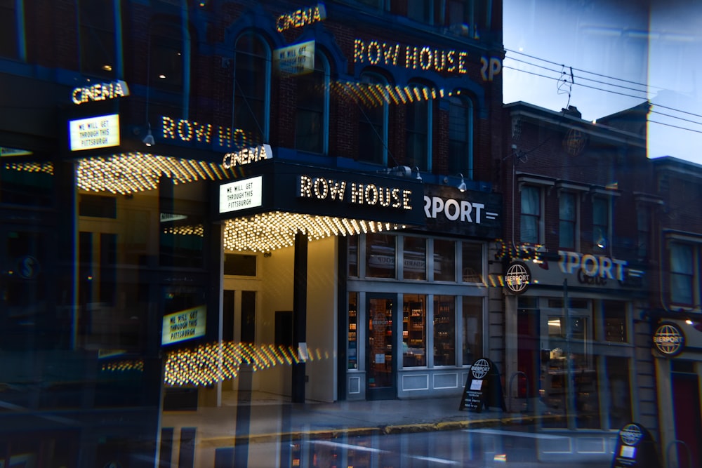 a building with a neon sign on the front of it