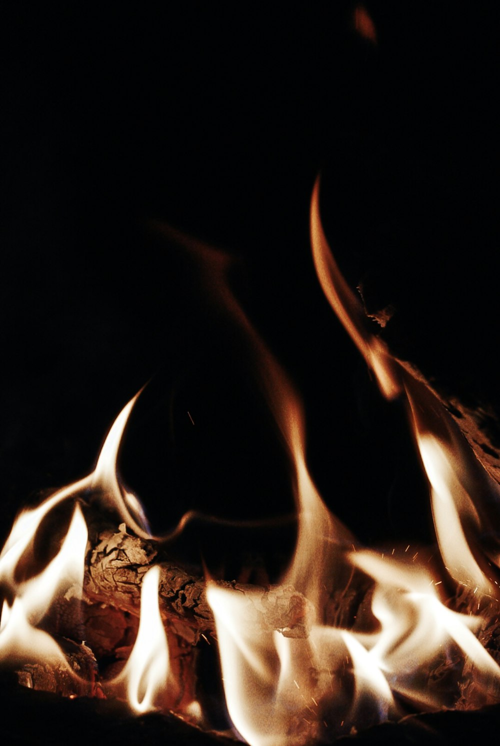 a close up of a fire in the dark