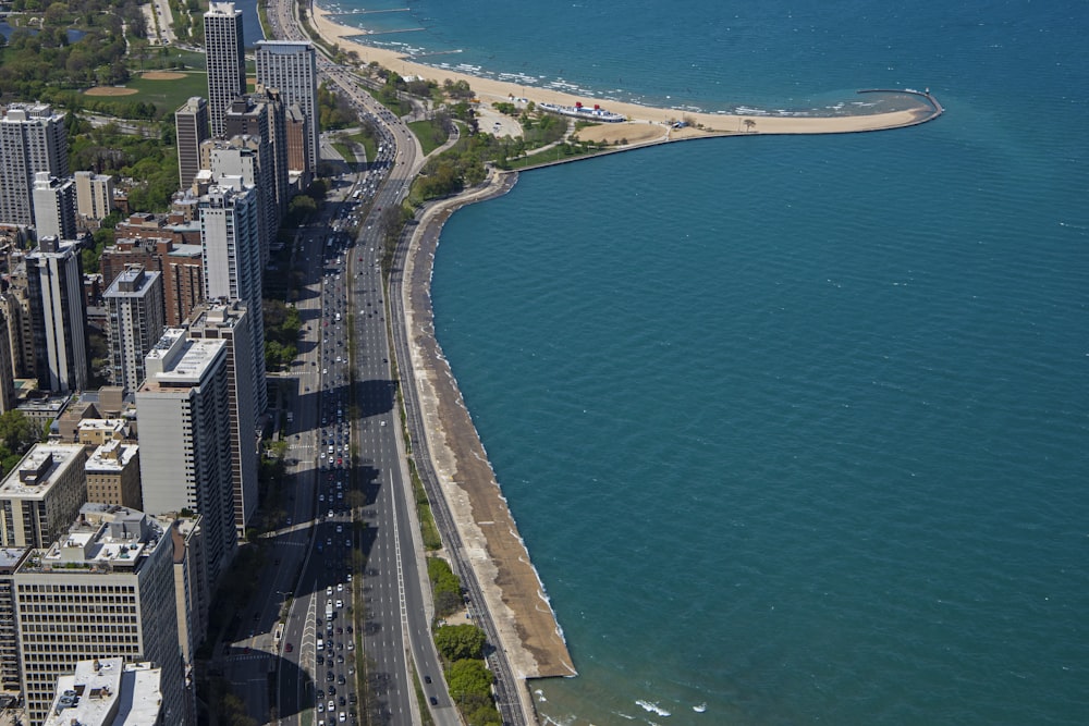 an aerial view of a city and a body of water