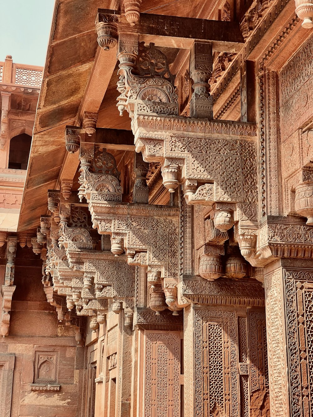a wooden building with intricate carvings on it
