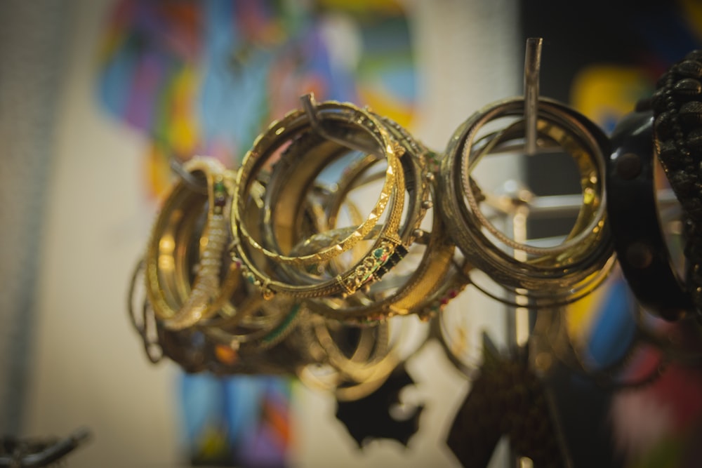 a bunch of rings are hanging on a rack