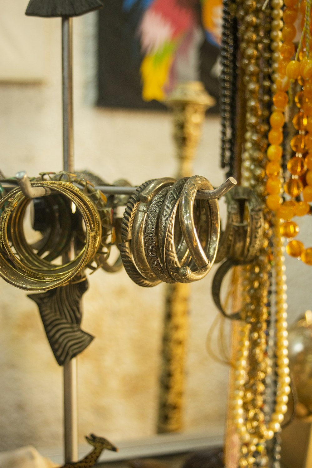 a bunch of rings are hanging on a rack