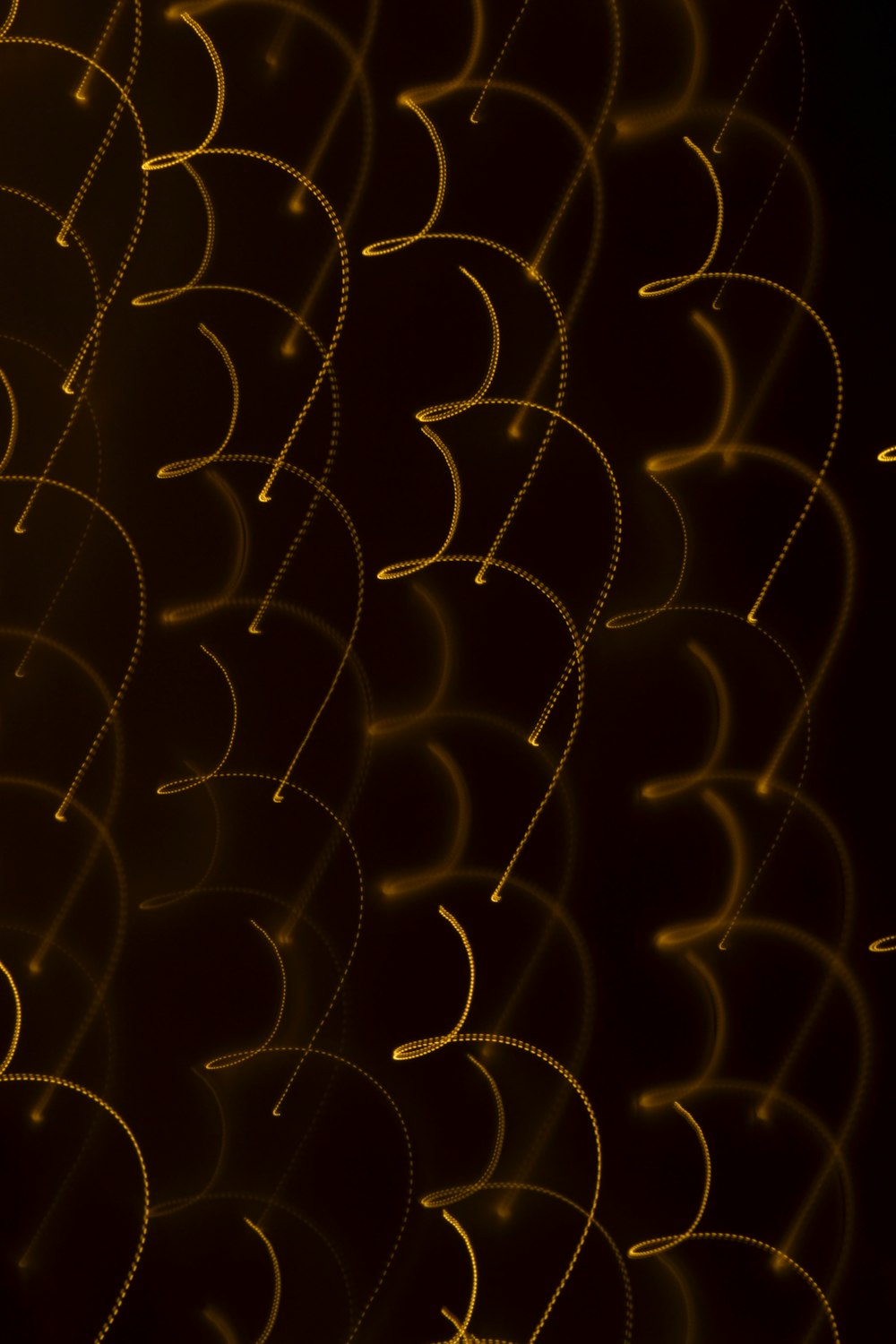 a black background with a bunch of yellow circles