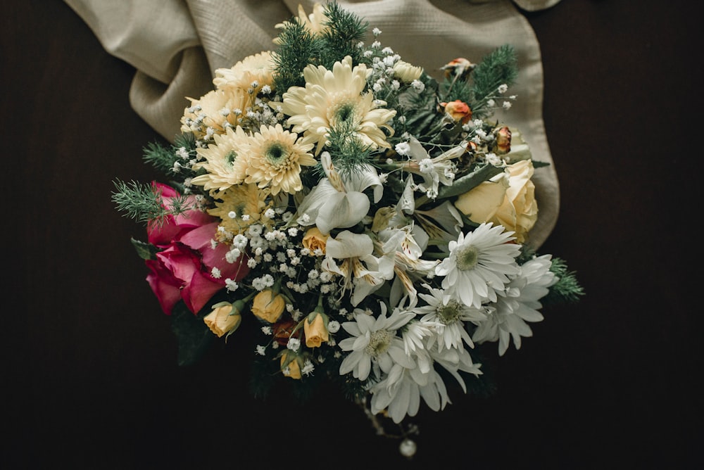 a bouquet of flowers sitting on top of a table