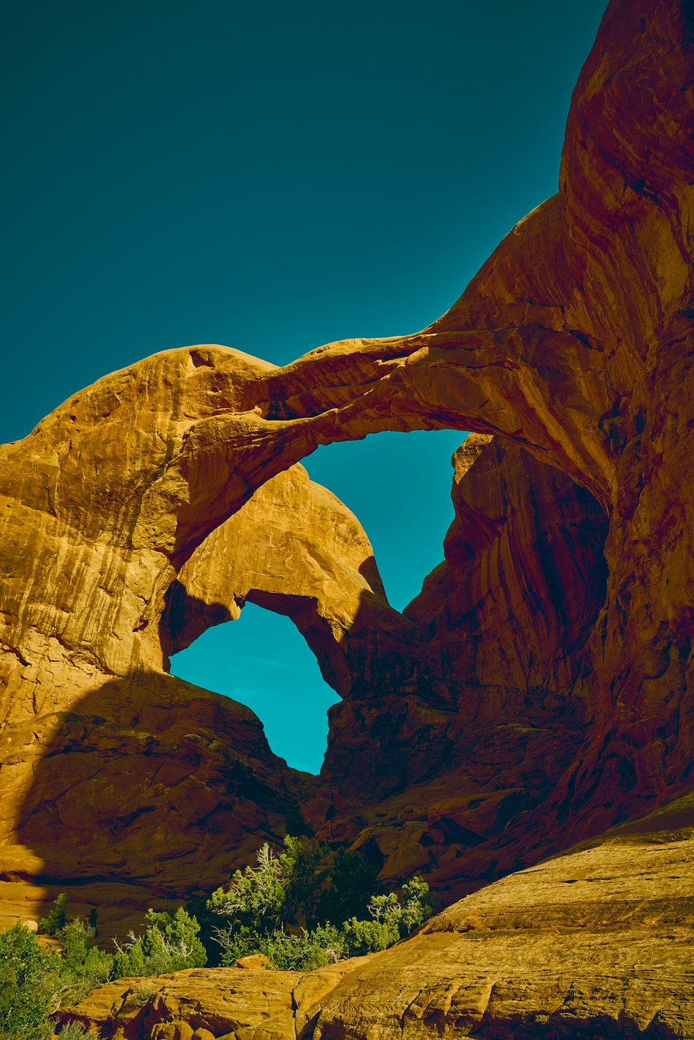 a large rock formation in the middle of a desert