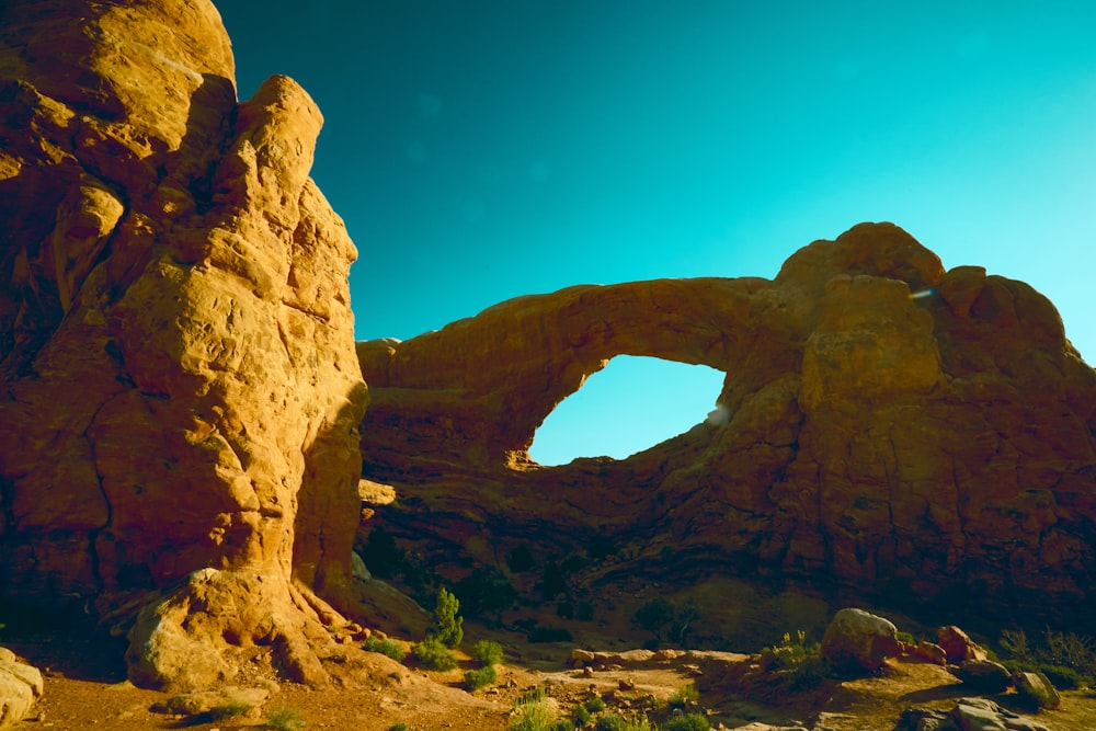 a large rock formation in the middle of a desert