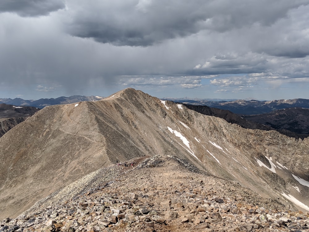 a view of a mountain range from the top of a mountain