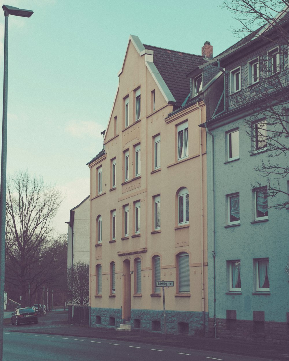 a tall building sitting on the side of a road