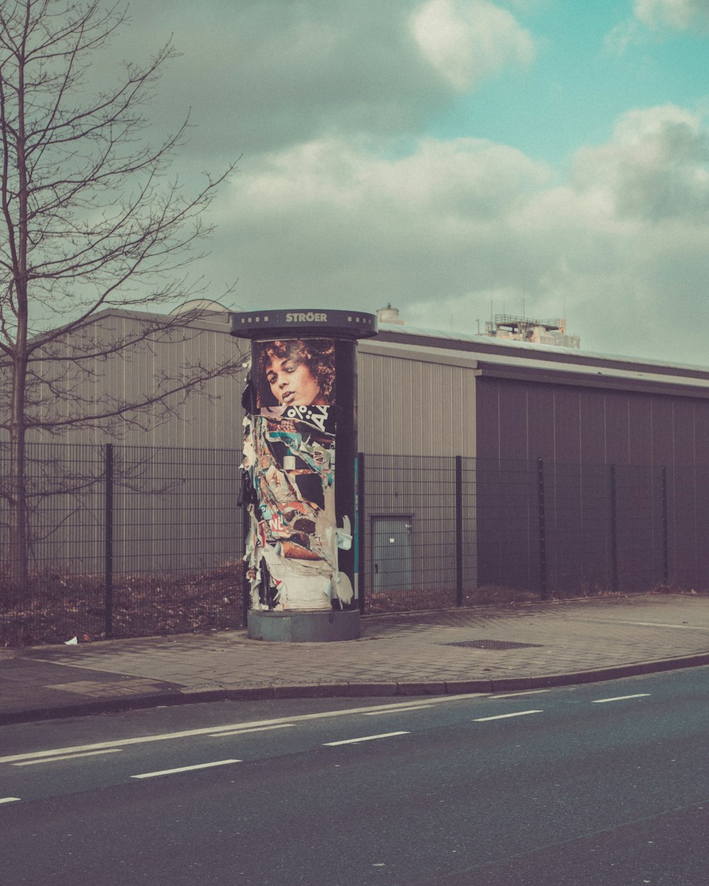 a telephone booth on the side of the road