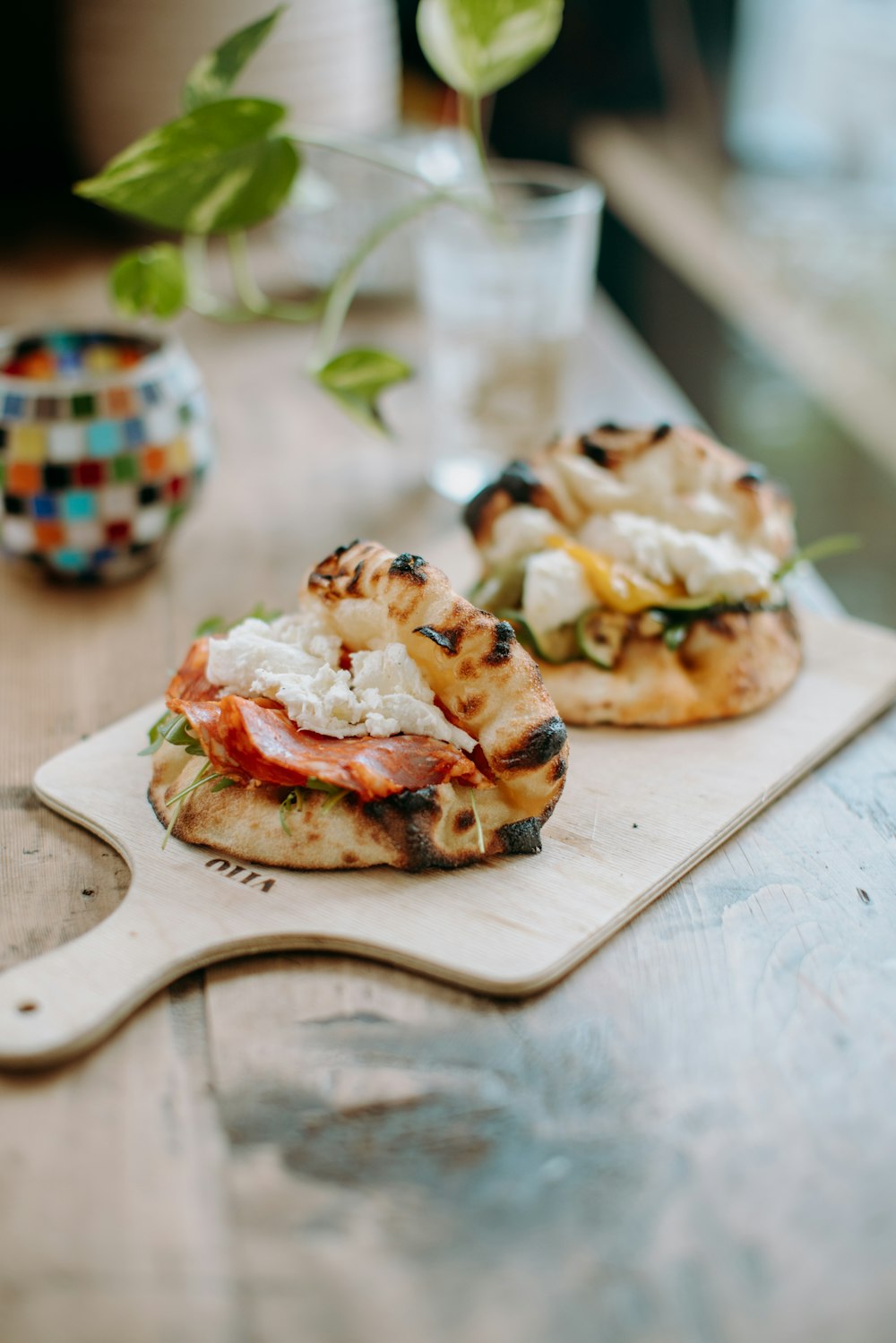 a close up of a pizza on a cutting board