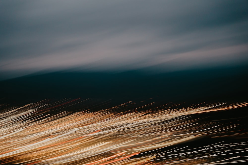 a blurry photo of a bird flying in the sky