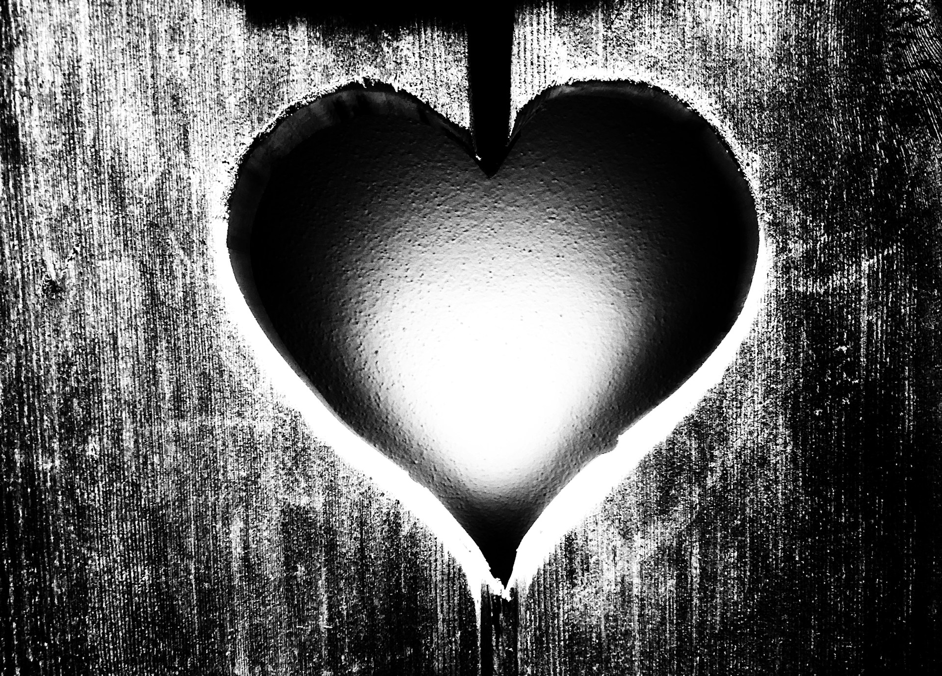 a black and white photo of a heart shaped object