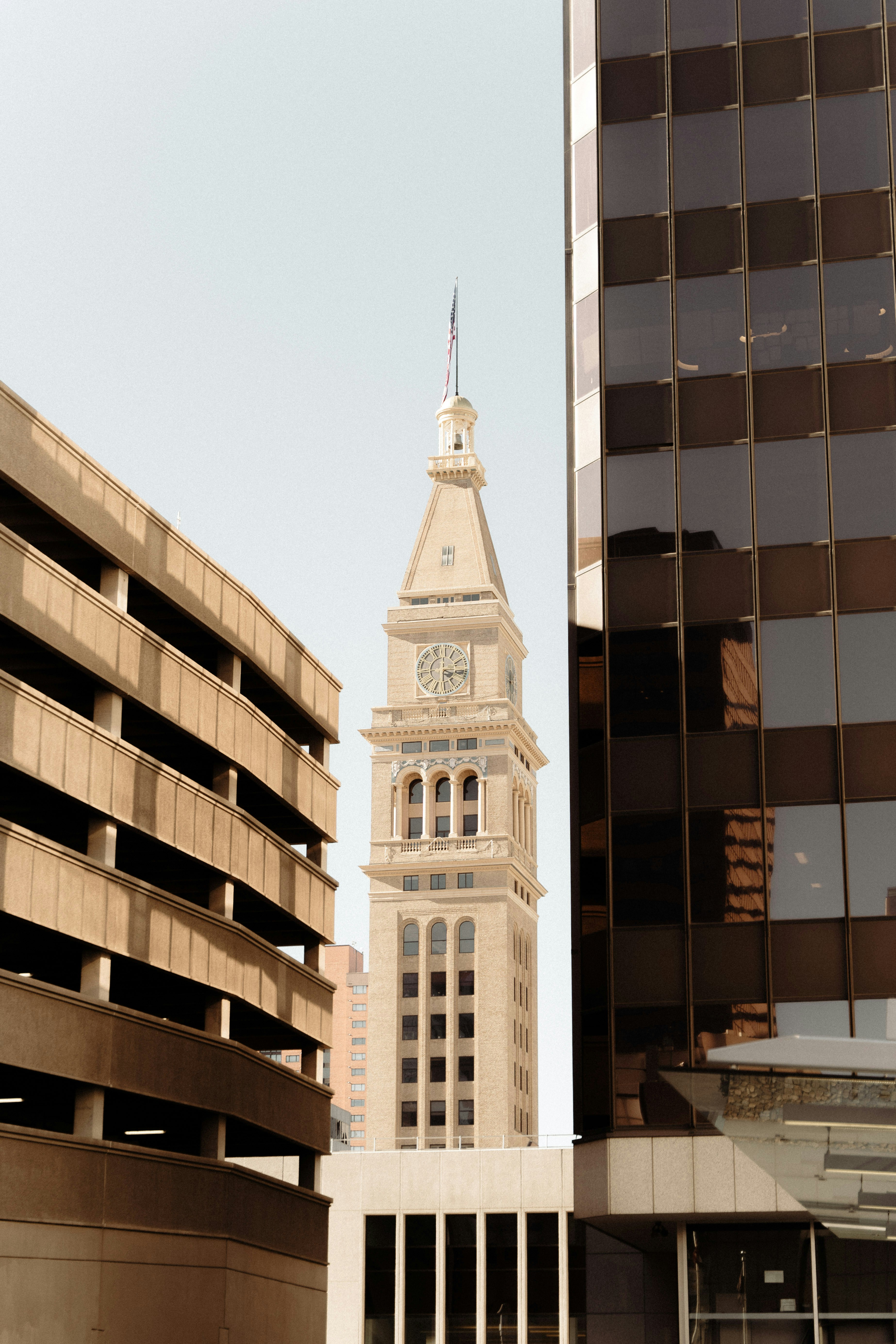 A tall clock tower towering over a city photo Free Tower Image on