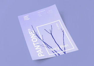 A Pantone color card featuring the color 'Very Peri' is prominently displayed on a light purple background. The card includes purple twig-like lines intersecting a white outlined square. Text includes various color codes and 'Color of the Year 2022'.