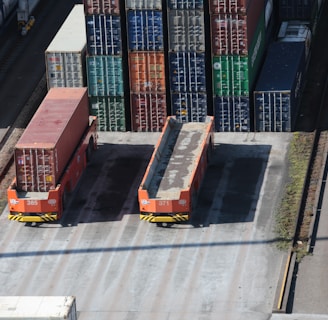 a train yard with cargo containers and train tracks