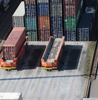 a train yard with cargo containers and train tracks