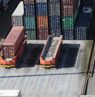 a train yard with cargo containers and train tracks