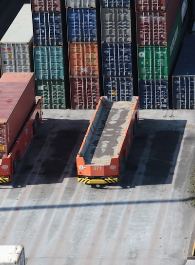 a train yard with cargo containers and train tracks