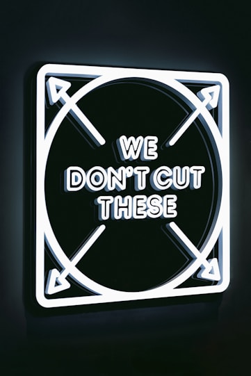 a neon sign that says we don't cut these