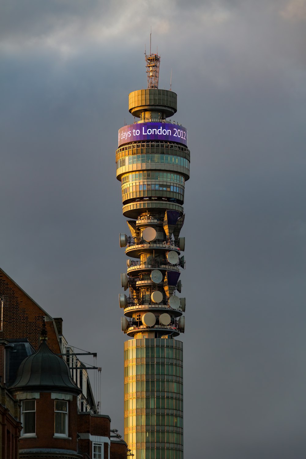 a very tall tower with a clock on it's side