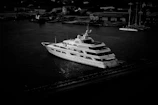 Black and white cinematic render of a yacht’s elegant silhouette against the horizon.