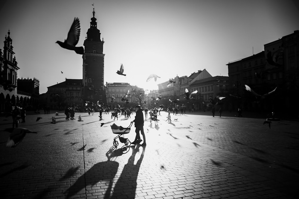 a black and white photo of a city square