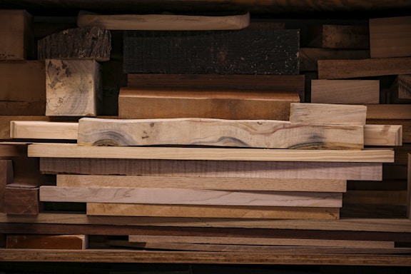 a pile of wooden planks stacked on top of each other
