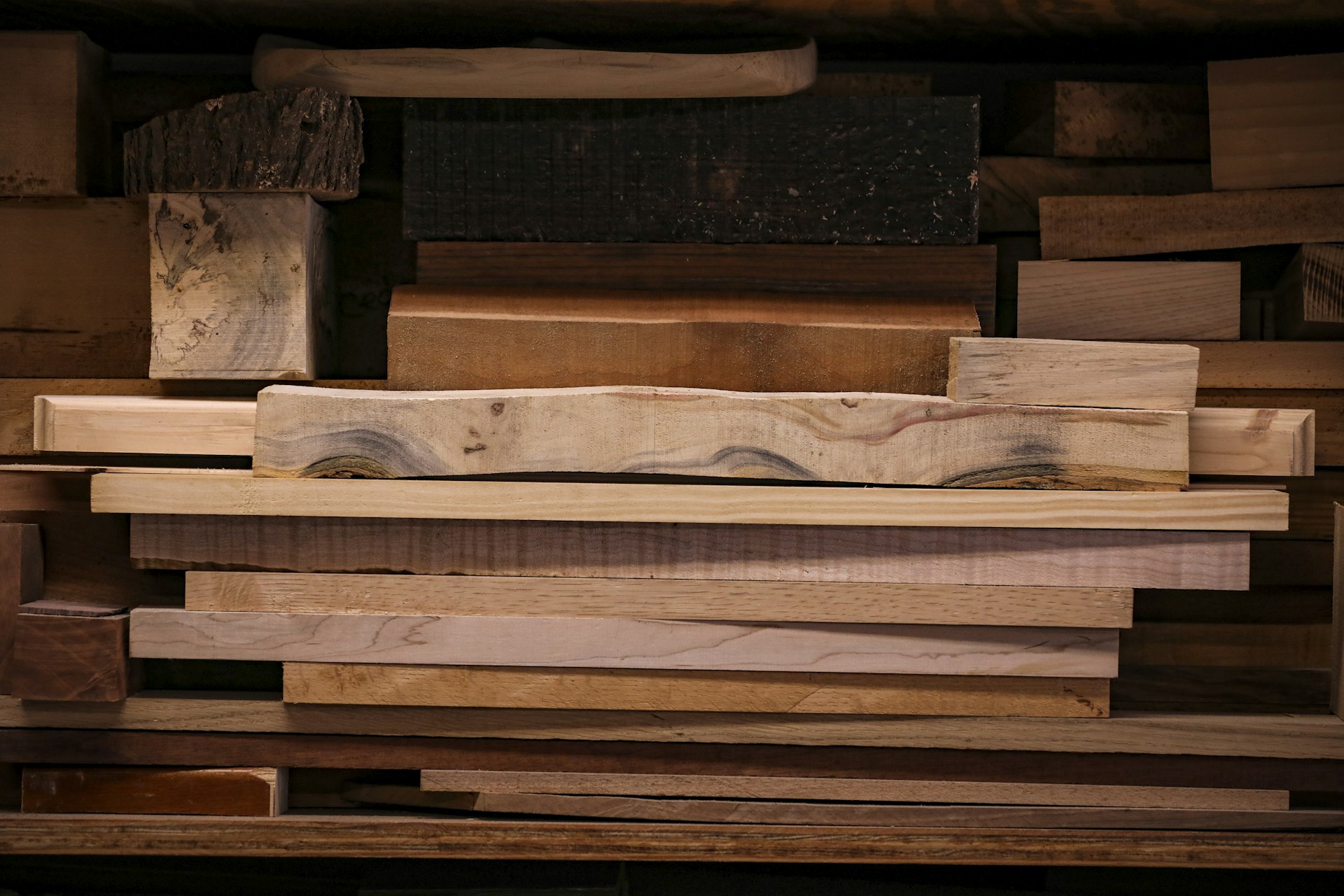 a pile of wooden planks stacked on top of each other