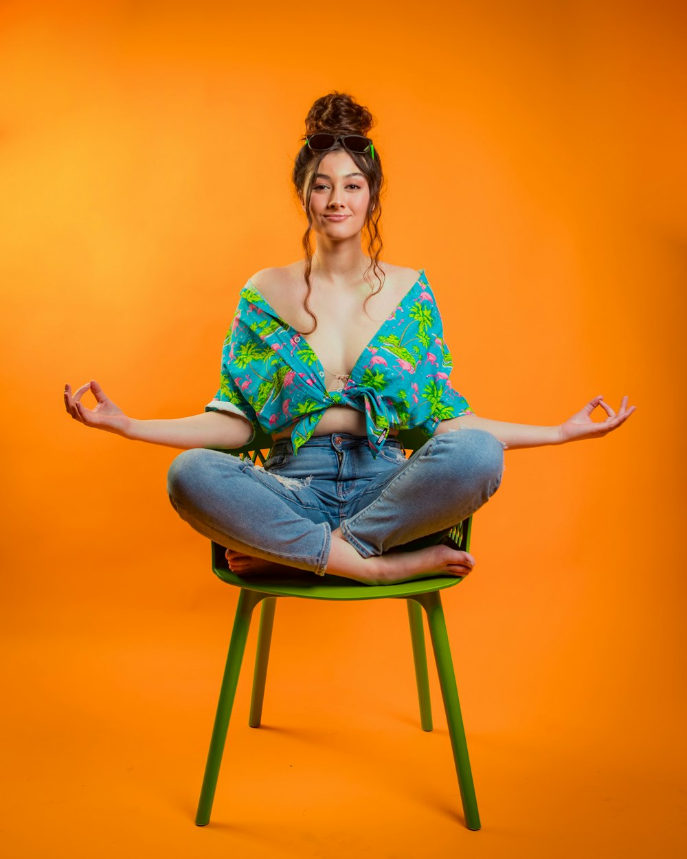 a woman sitting in a chair with her arms crossed