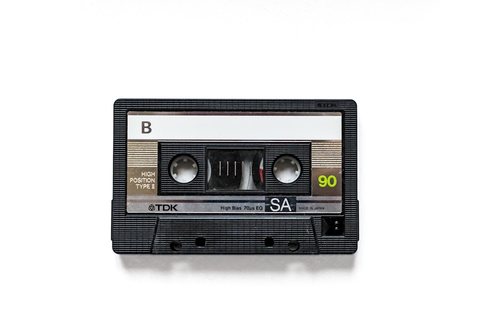 a black and white tape recorder on a white background