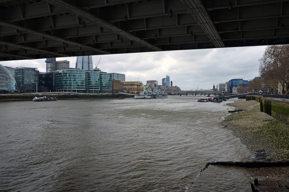 a view of a river from under a bridge