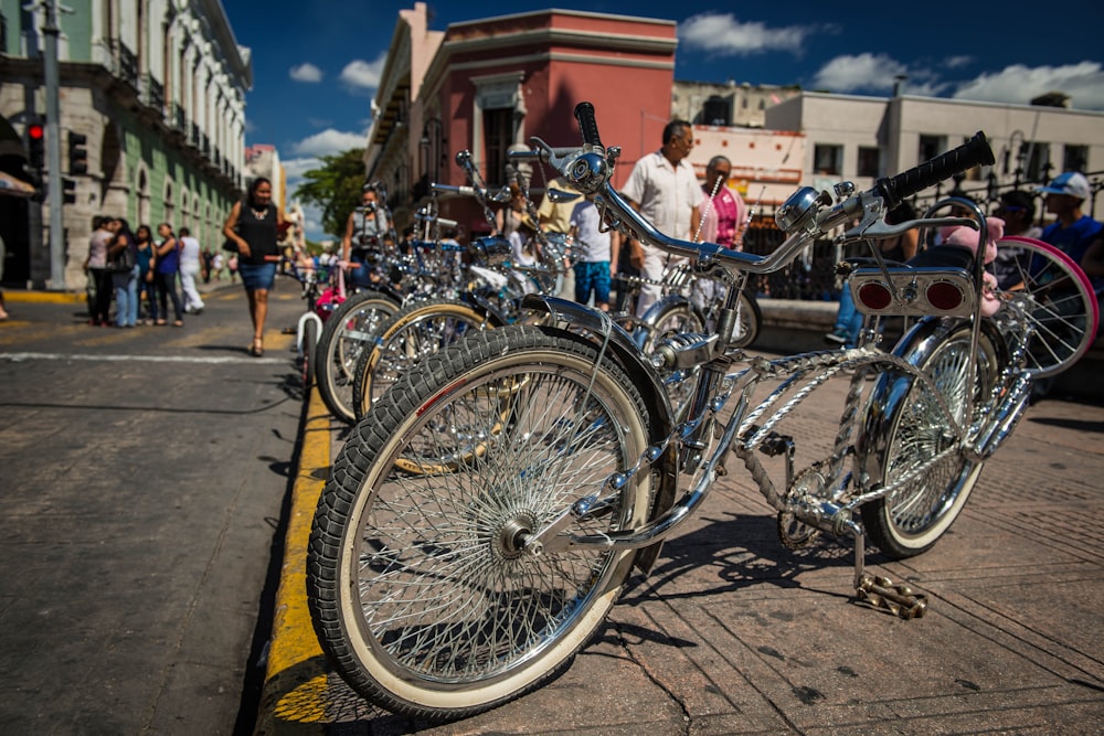 a group of bicycles parked next to each other on a street