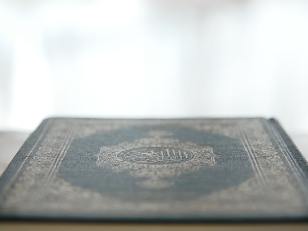 A close-up of a meditative puzzle book with intricate designs and patterns.