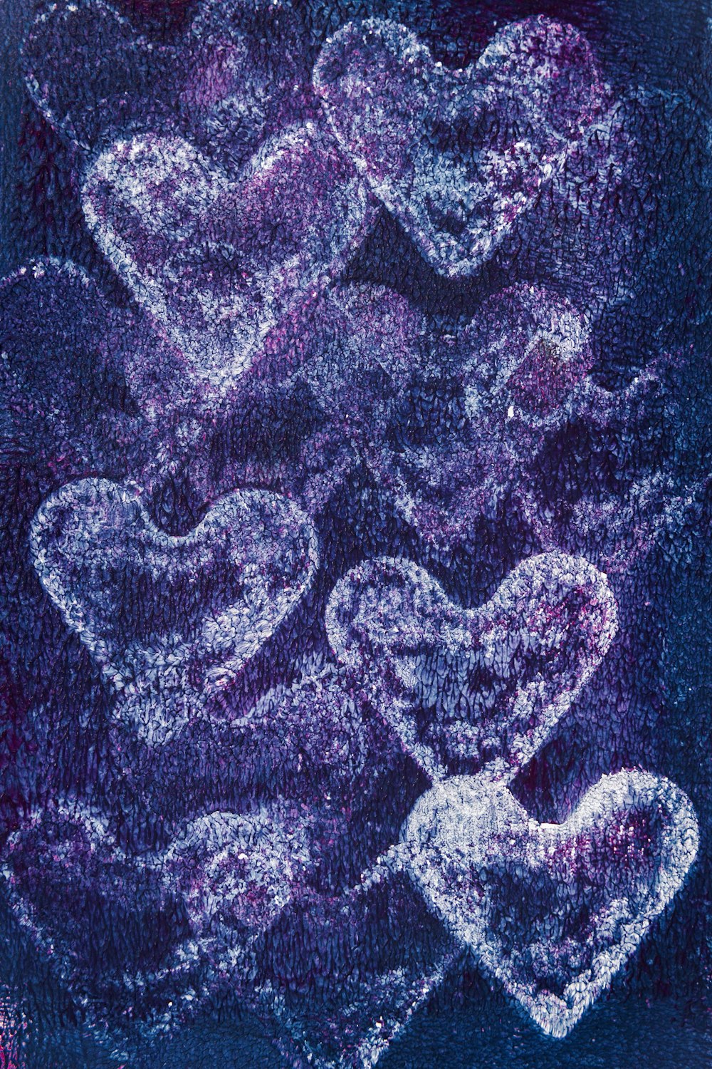 a painting of hearts on a blue background