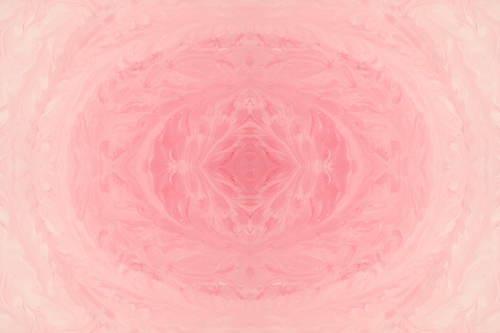 a pink and white photo of a circular object