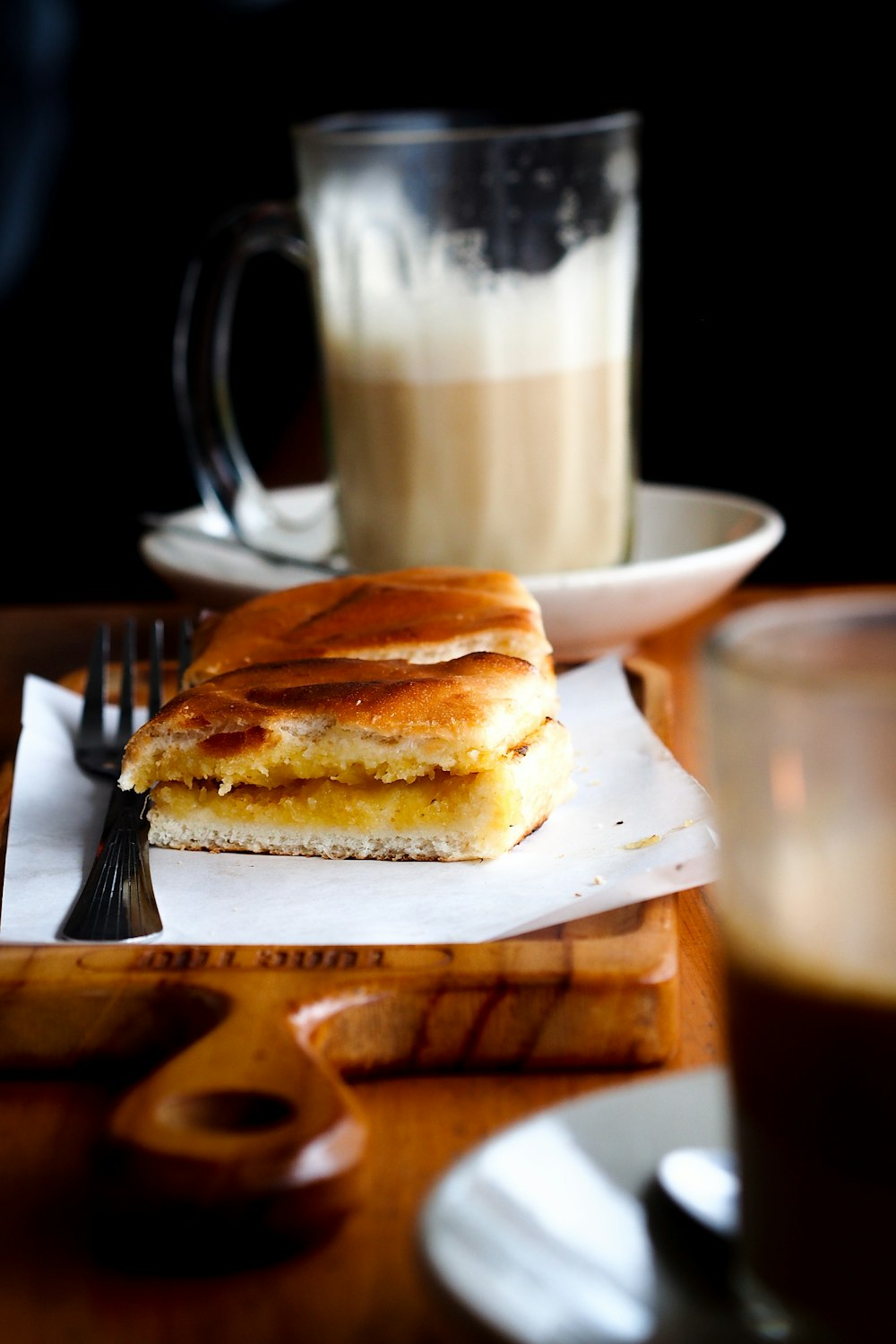 a plate of food and a cup of coffee on a table