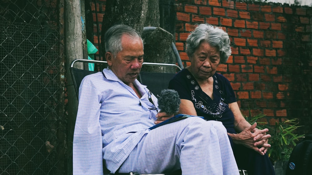 a man and woman sitting next to each other