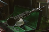 a close up of a saxophone in a case