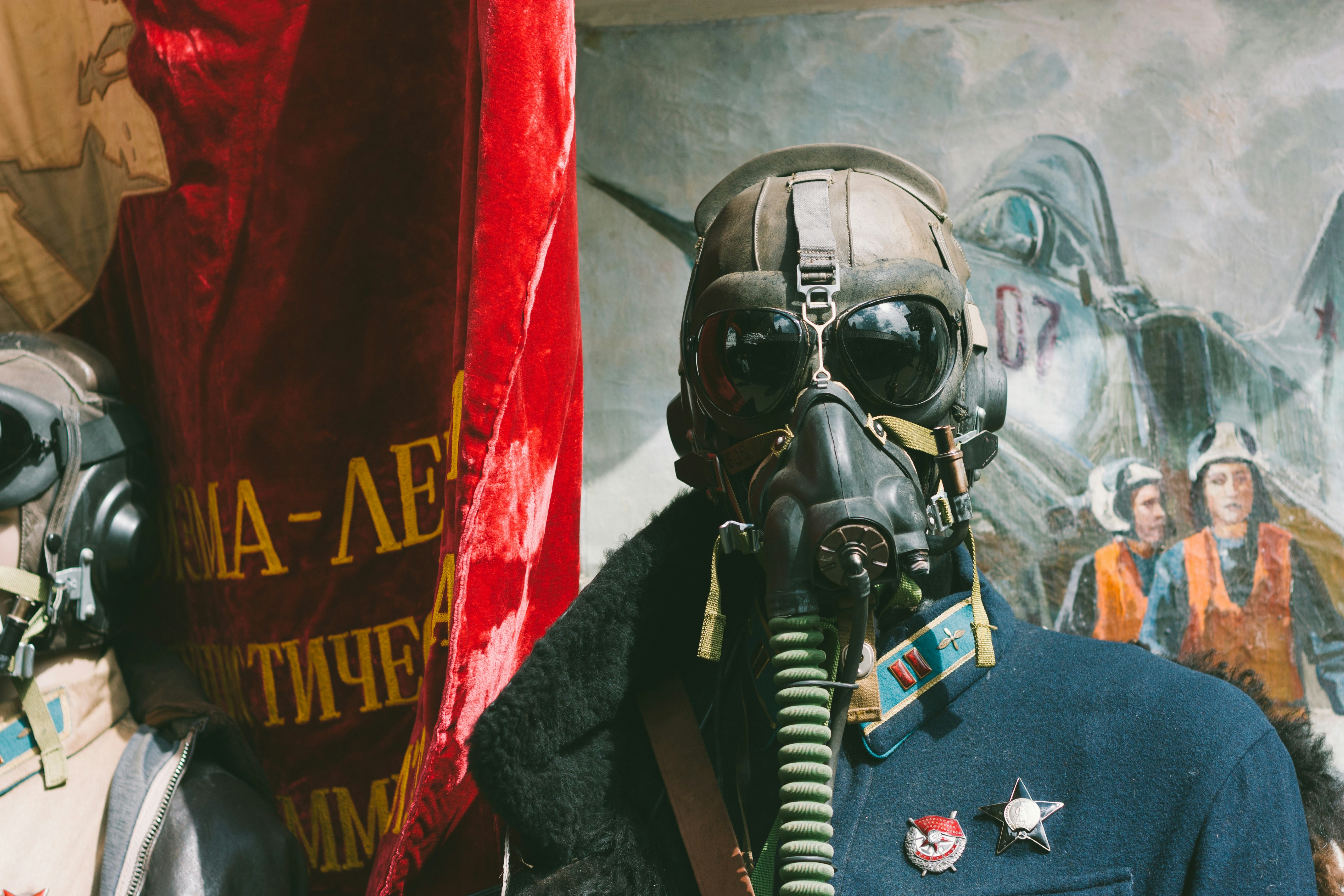 a man wearing a gas mask and uniform